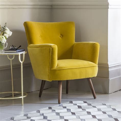 The combination of the mustard yellow chair paired with the geometric prints on the throw pillow is stunning! Archie Armchair in Mustard Yellow Velvet | Leather chairs ...
