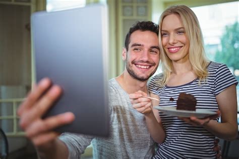 Free Photo Smiling Couple Taking Selfie From Digital Tablet