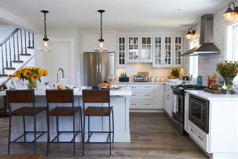 Available in many sizes, shapes and finishes, kitchen islands are not only practical, but are also attractive and provide a variety of features for organization and convenience. Simply White Kitchen with Light Grey Island - Crystal Cabinets