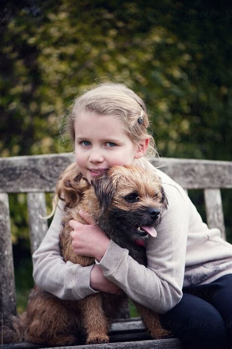 Girl Hugging Her Dog By Stocksy Contributor Christina K Stocksy