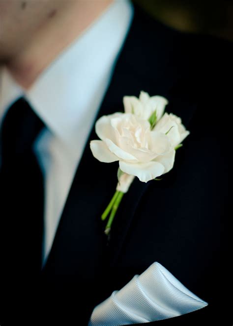 Elegant White Spray Roses Boutonniere For The Groom