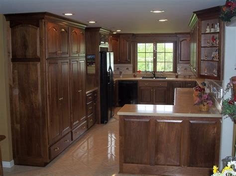 Going into 2021, wood stained kitchen cabinets will still be popular in more traditional kitchens. Modern Black Walnut Kitchen Cabinets - Decor IdeasDecor Ideas
