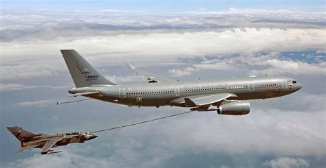 An RAF Voyager Tanker Aircraft Refuels a Tornado GR4. The Voyager is ...