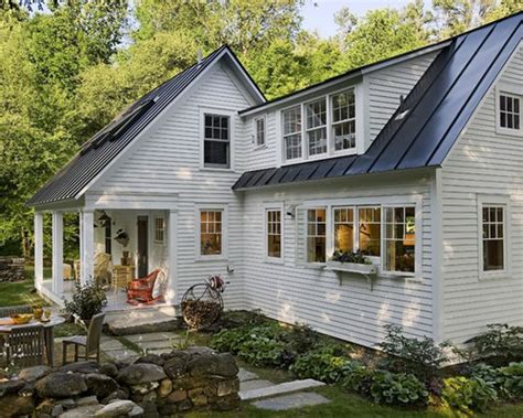 The house has a green metal roof. Black Metal Roof | Houzz