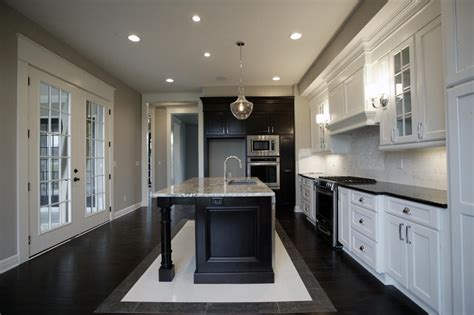 Why choose gray kitchen interior design? Elegant Gray Kitchen Features Black & White Cabinetry | HGTV
