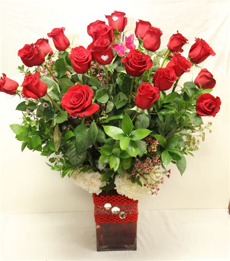 Carolina Two Dozen Long Stem Red Roses In A Tall Crystal Vase In