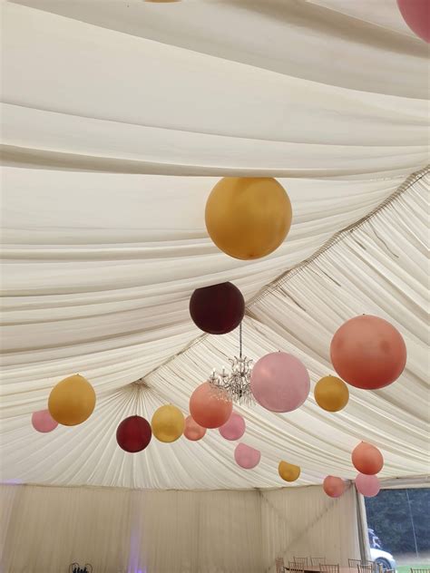 Hang Huge Balloons From The Marquee Ceiling To Add Colour And Drama