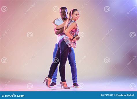 Young Couple Dances Social Caribbean Salsa Studio Shot Stock Photo