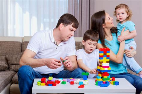 Como cualquier juego, los juegos de mesa también fomentan la creatividad. Family Playing Board Game At Home. Stock Image - Image of ...