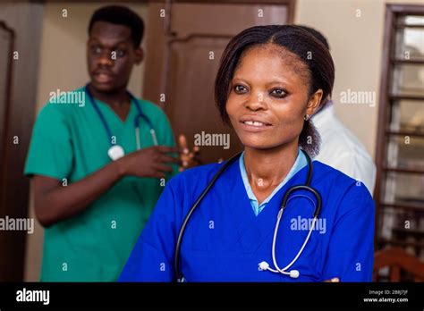 group of happy doctors with stethoscopes or a mentor with trainees