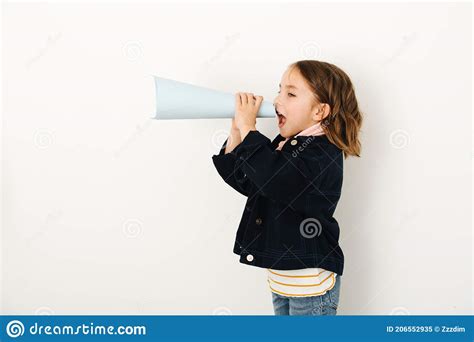 Little Girl Screams In Loudspeaker Curled Into A Cone Sheet Of Paper