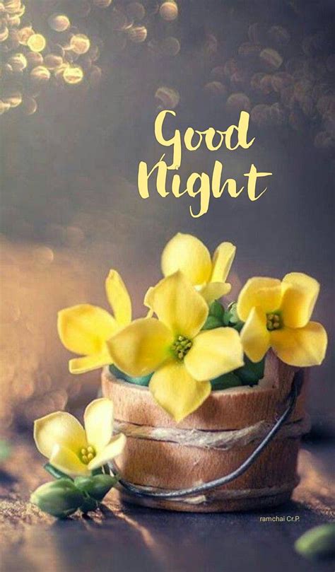 Some Yellow Flowers Are Sitting In A Small Basket On The Ground With Words Good Morning