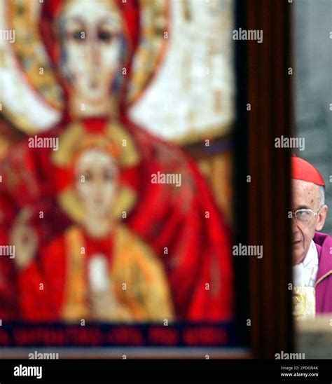 Cardinal Camillo Ruini is seen behind an icon of the virgin Mary and