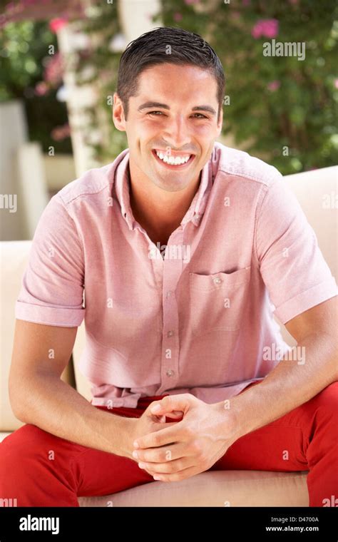 Man Relaxing On Sofa At Home Stock Photo Alamy