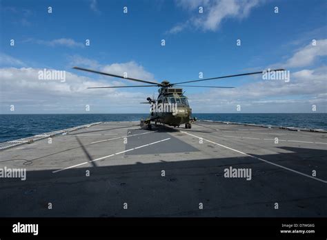 A Royal Navy Sea King Mk4 Helicopter On The Flight Deck Of Type 45