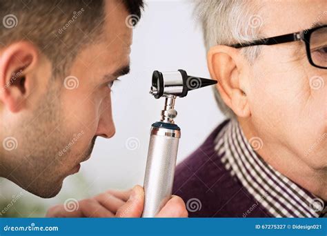 Doctor Examining Ear Of A Patient Stock Image Image Of Male Otoscope