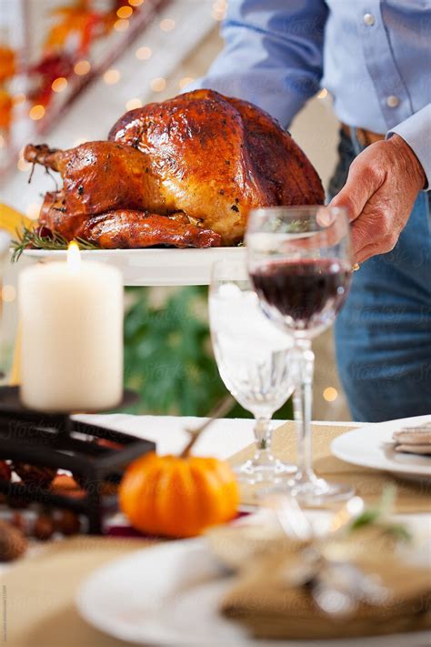 Thanksgiving Bringing The Turkey On A Platter By Stocksy Contributor