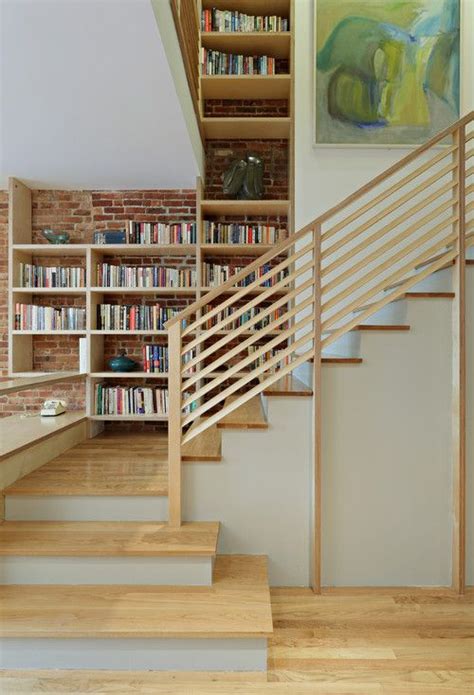 This wood railing uses small crosses that give the appearance of a diamond pattern from a horizontal cable railing runs from post to post above vertical 2×2 pickets in an interesting. horizontal wooden railing | Staircase design, Stairs ...