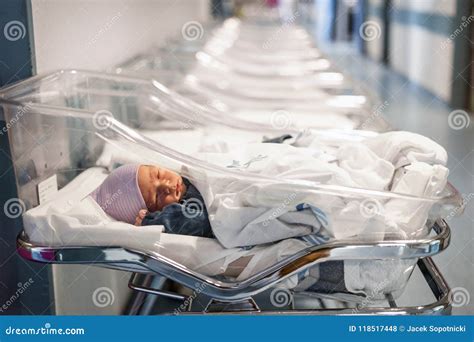 Newborn Baby In First Of Many Small Hospital Beds Stock Photo Image