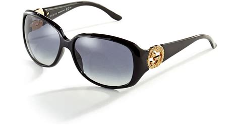 gucci logo accented sunglasses in black lyst