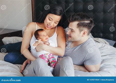 Caucasian Father Dad With Newborn Mixed Race Asian Chinese Yawning Baby