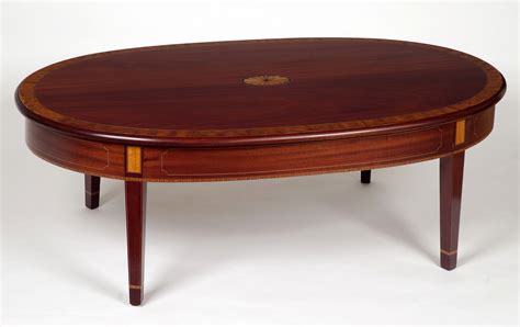 A rectangular mahogany coffee table from niagara furniture with all of the bells and whistles including four drawers, reeded legs, solid brass capped feet and cookie shaped, rounded corners. Mahogany Coffee Table Design Images Photos Pictures