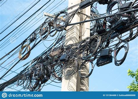 Messy Fiber Optic Cables Hung On Electric Poles Royalty Free Stock