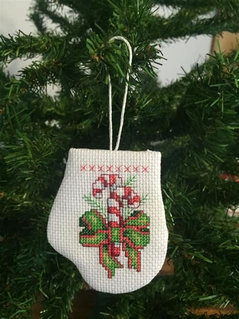 Love to cross stitch or want to learn how? Candy Cane Mitten Ornament | Etsy | Cross stitch christmas ...