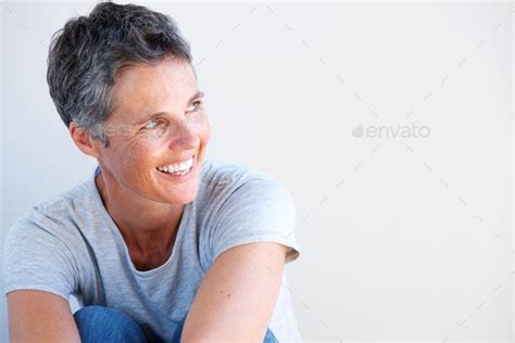 Close Up Beautiful Older Woman Smiling Against White Background By