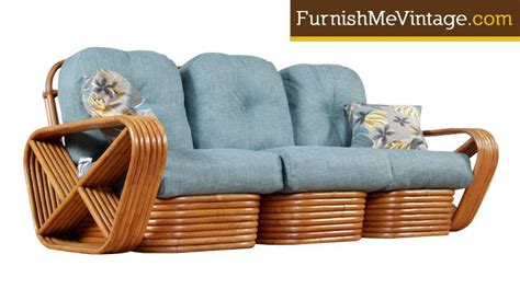 A handsome and tropically modern club chair and ottoman, circa 1970s. Restored Mid Century Modern Rattan Rocking Chair