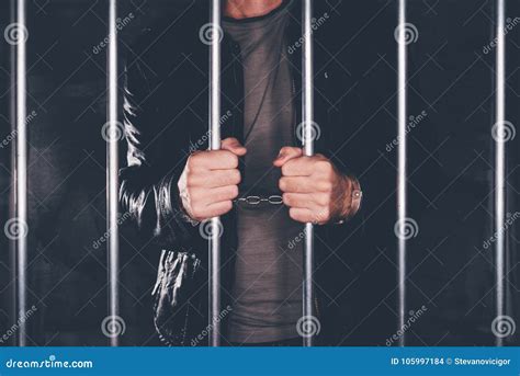 Handcuffed Man Behind Prison Bars Stock Photography Cartoondealer Com