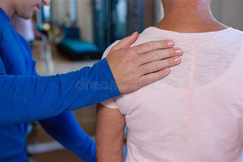 Physiotherapist Giving Back Massage To Female Patient Stock Image Image Of Osteopath Elderly