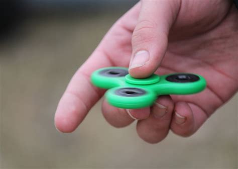 understanding the physics of fidget spinners