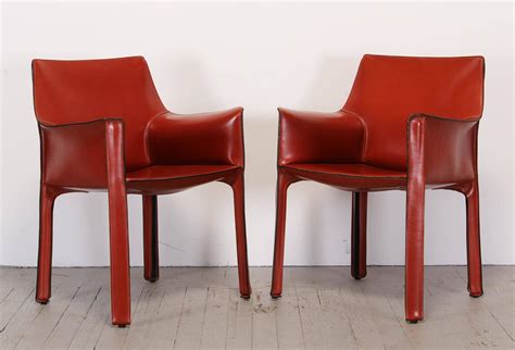 The seat is padded with polyurethane foam. Pair of 413 Cab Chairs by Mario Bellini by Cassina at 1stdibs
