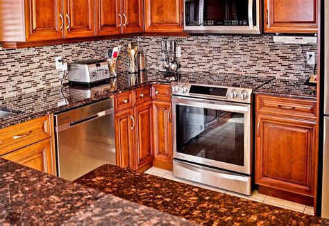 Cabinets and countertops in grays can make a monochromatic kitchen seem cold, but all it takes is a pop of for example, giallo ornamental granite is known for its creamy golden tones with flecks of dark brown minerals that make. Tan Brown Granite Countertops (Pictures, Cost, Pros and ...