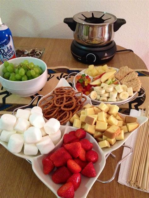 I like to serve this cheddar cheese fondue recipe with apple slices, rye bread cubes and chunks of carrots, mushrooms, celery, zucchini, squash and broccoli. Custom comfort food for a girls' night in - SheKnows