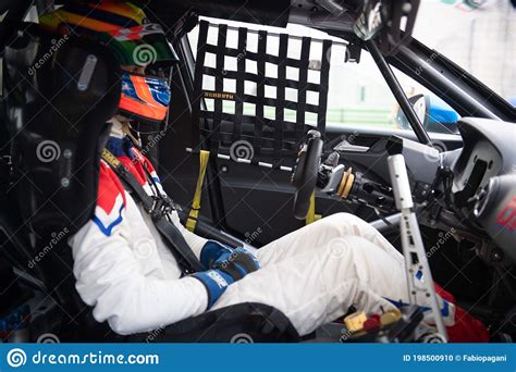 Racing Weekend Touring Car Driver With Helmet And Suit Sitting In Cockpit Editorial Image