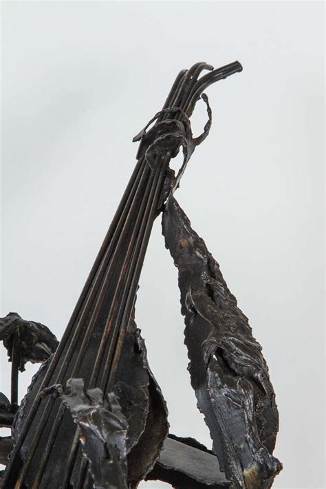 Guitar man playing guitar with musical notes and sound. Metal Sculpture of Man Playing Guitar For Sale at 1stdibs