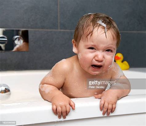 Baby Crying Bath Photos And Premium High Res Pictures Getty Images