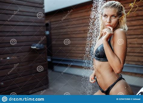 Woman In Swimsuit Showering Under Water Washing Hair Cleaning Body