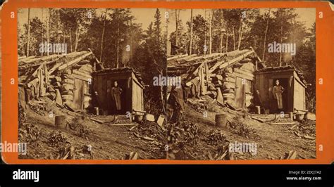 Woman Stands In Doorway Of Log Cabin On The Northern Pacific Road