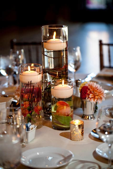 Floating Candle Wedding Centerpiece With Submerged Flowers And Branches