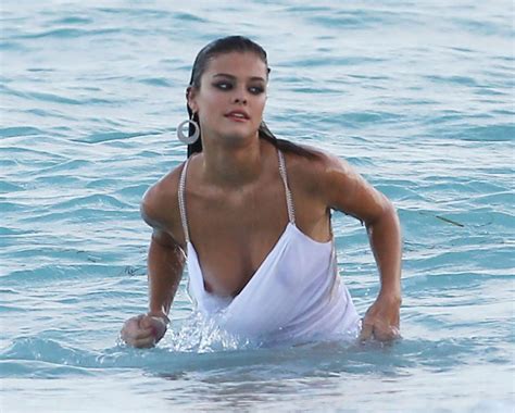 Hot Nina Agdal Has A Couple Wardrobe Malfunctions While Navigating The Surf For A Photoshoot