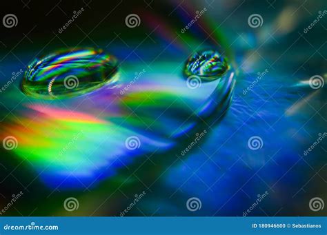 Light Diffraction Showing Rainbows On Water Drops Royalty Free Stock