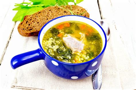 It's usually served as a side dish or. Soup With Couscous And Spinach In Blue Bowl On Light Board ...