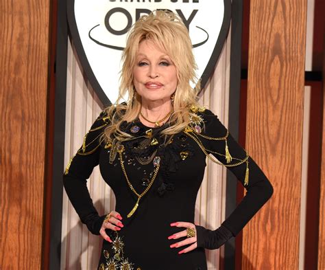 why does dolly parton wear long sleeves she has numerous tattoos