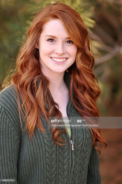 pretty redheaded model with a great smile she has long hair that is red hair freckles