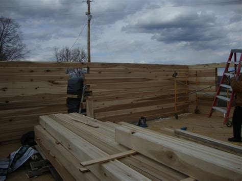 Best log home prices, cheep log homes, log home builders, rustic log cabin, rustic log homes, tulip poplar log homes, what is tulip poplar. Grizzly Log Homes: Tulip poplar log stack in Kn April