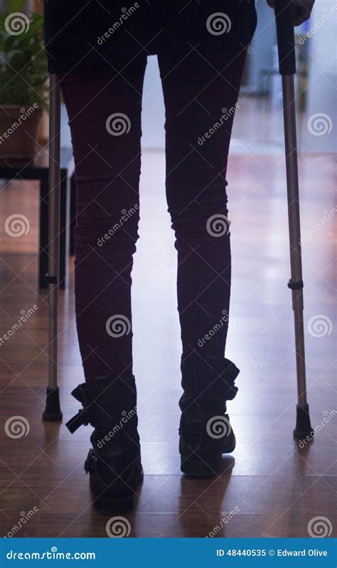 Young Lady On Crutches In Hospital Clinic Silhouette Stock Image