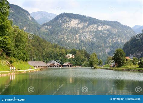 Panorama View Of Lake Königssee With Mountains And Boathouses In